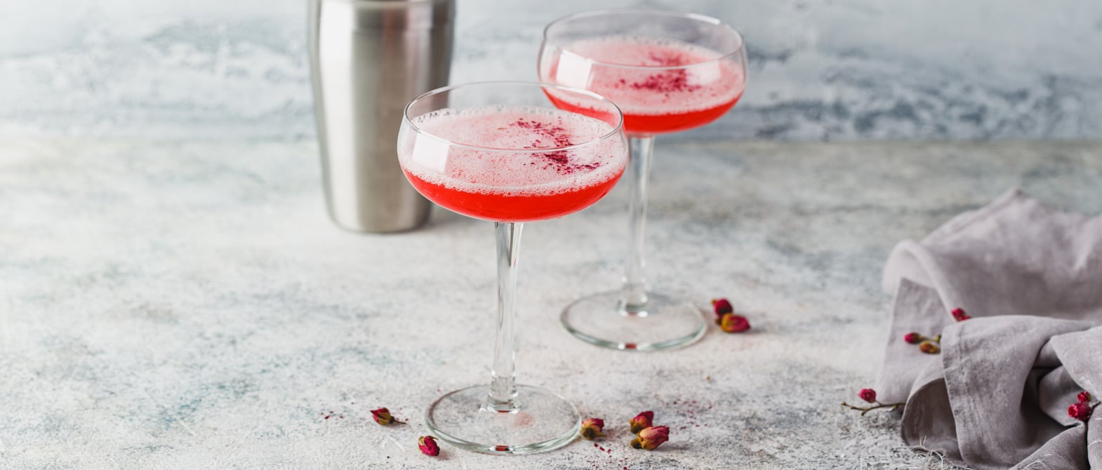 Two sparkling wine Champagne cocktails in elegant glassware